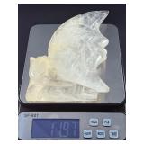 Hand-Carved Moon with Rose is a beautifully detailed crystal carving that blends celestial symbolism with gentle, heart-centered beauty. Shaped into a graceful crescent moon and adorned with a delicat