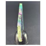 Rainbow Fluorite Slab is a stunning, polished slice that showcases fluorite’s signature bands of purple, green, blue, and soft teal hues.