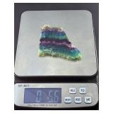 Rainbow Fluorite Slab is a stunning, polished slice that showcases fluorite’s signature bands of purple, green, blue, and soft teal hues.