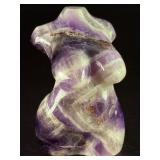 Divine Feminine Amethyst Chevron is a beautifully patterned crystal that combines the deep purple of amethyst with milky white quartz in distinctive V-shaped chevron banding.