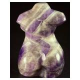 Divine Feminine Amethyst Chevron is a beautifully patterned crystal that combines the deep purple of amethyst with milky white quartz in distinctive V-shaped chevron banding.