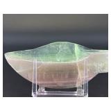 Fluorite Leaf Dish is a hand-carved crystal piece shaped like a delicate leaf bowl, showcasing the natural banding and vibrant colors of fluorite.