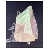 Fluorite Leaf Dish is a hand-carved crystal piece shaped like a delicate leaf bowl, showcasing the natural banding and vibrant colors of fluorite.