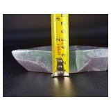 Fluorite Leaf Dish is a hand-carved crystal piece shaped like a delicate leaf bowl, showcasing the natural banding and vibrant colors of fluorite.
