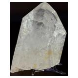 Quartz Point - Golden Healer is a striking crystal featuring clear quartz accented with subtle golden tones from natural iron inclusions, known as Golden Healer.