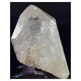 Quartz Point - Golden Healer is a striking crystal featuring clear quartz accented with subtle golden tones from natural iron inclusions, known as Golden Healer.