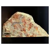 Crazy Lace Agate is a vibrant and eye-catching crystal known for its intricate, swirling patterns and lively mix of colors, typically including creamy whites, warm reds, oranges, and browns.