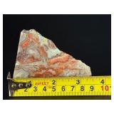 Crazy Lace Agate is a vibrant and eye-catching crystal known for its intricate, swirling patterns and lively mix of colors, typically including creamy whites, warm reds, oranges, and browns.