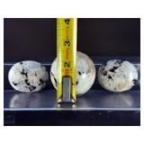 Rainbow Moonstone Sphere and Palm Stones are enchanting pieces that showcase the soft, luminous glow and signature flashes of rainbow sheen unique to rainbow moonstone.