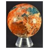 Sunstone and Blue Apatite Sphere is a striking crystal sphere that combines the warm, radiant energy of sunstone with the calming, deep blue tones of apatite.