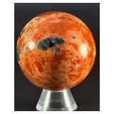 Sunstone and Blue Apatite Sphere is a striking crystal sphere that combines the warm, radiant energy of sunstone with the calming, deep blue tones of apatite.