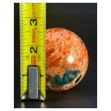 Sunstone and Blue Apatite Sphere is a striking crystal sphere that combines the warm, radiant energy of sunstone with the calming, deep blue tones of apatite.