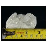 Hand-Carved Quartz Frog Cluster is a charming and energetically vibrant crystal piece, expertly carved into the shape of a frog while preserving the natural beauty of the quartz cluster.