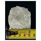 Hand-Carved Quartz Frog Cluster is a charming and energetically vibrant crystal piece, expertly carved into the shape of a frog while preserving the natural beauty of the quartz cluster.