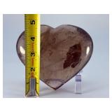 Large Smoky Quartz Heart with Rainbows & Inclusions is a striking, hand-polished crystal heart. The rich, earthy tones of smoky quartz along with natural internal inclusions that create captivatin
