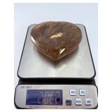 Large Smoky Quartz Heart with Rainbows & Inclusions is a striking, hand-polished crystal heart. The rich, earthy tones of smoky quartz along with natural internal inclusions that create captivatin