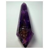 Extra Large Amethyst Vogel Double Terminated is a powerful and visually striking crystal, expertly carved into the iconic Vogel shape with pointed terminations at both ends.