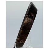 Arfvedsonite Heart Dish is a beautifully hand-carved crystal dish shaped like a heart, showcasing the deep, inky blue-black tones and striking natural patterns of arfvedsonite.