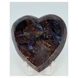 Arfvedsonite Heart Dish is a beautifully hand-carved crystal dish shaped like a heart, showcasing the deep, inky blue-black tones and striking natural patterns of arfvedsonite.