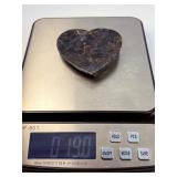 Arfvedsonite Heart Dish is a beautifully hand-carved crystal dish shaped like a heart, showcasing the deep, inky blue-black tones and striking natural patterns of arfvedsonite.