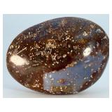 Orbs Ocean Jasper Palm Stone is a smooth, hand-polished crystal shaped to fit comfortably in the palm, showcasing the signature orb-like patterns and soothing earthy tones of ocean jasper.