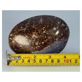 Orbs Ocean Jasper Palm Stone is a smooth, hand-polished crystal shaped to fit comfortably in the palm, showcasing the signature orb-like patterns and soothing earthy tones of ocean jasper.