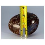 Orbs Ocean Jasper Palm Stone is a smooth, hand-polished crystal shaped to fit comfortably in the palm, showcasing the signature orb-like patterns and soothing earthy tones of ocean jasper.