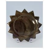 Golden Obsidian Sun is a striking crystal piece carved into a radiant sun shape, showcasing the deep black sheen of obsidian accented with shimmering golden flashes.