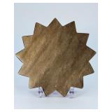 Golden Obsidian Sun is a striking crystal piece carved into a radiant sun shape, showcasing the deep black sheen of obsidian accented with shimmering golden flashes.