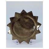 Golden Obsidian Sun is a striking crystal piece carved into a radiant sun shape, showcasing the deep black sheen of obsidian accented with shimmering golden flashes.