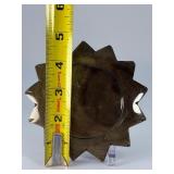 Golden Obsidian Sun is a striking crystal piece carved into a radiant sun shape, showcasing the deep black sheen of obsidian accented with shimmering golden flashes.