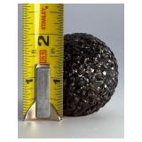 Chiseled Obsidian Sphere is a bold and captivating crystal sphere sculpted from natural obsidian. Its smooth, polished surface is enhanced with subtle chiseled facets, creating depth, texture, and a d