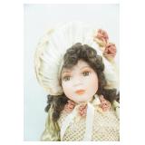 Porcelain Doll. Sits 17.5" tall