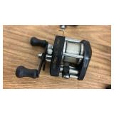 Collection of 6 Fishing Reels including Penn, Shakespeare, and Abu Garcia