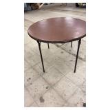Round Folding Table with Brown Top and Metal Legs