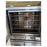 Heavy-duty commercial convection ovens in a stacked configuration