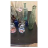 Collection of Vintage Glass Bottles and Welch