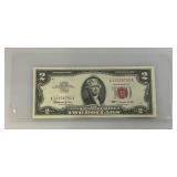 2 Dollar Bill From 1963 With Red Seal And Red Numbers (Very Good Condition) In Protective Sleeve)