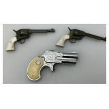 Misc. Vintage Miniature Cap Guns Two Break Open Pistols With Cow Adorned Handles And One Derringer (Missing Hammer)