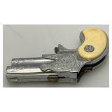 Misc. Vintage Miniature Cap Guns Two Break Open Pistols With Cow Adorned Handles And One Derringer (Missing Hammer)