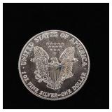 1987 Silver Eagle - 99.9% pure silver One Troy Ounce  - TAX EXEMPT  Slight blemish on Obverse side