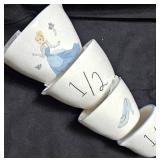 Sad Iron (flat clothing iron) from the 19th Century, Disney Princess set of 4 measuring cups By Rae Dunn, Porcelain Chrysanthemum shape pair of salt and pepper shakers