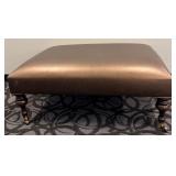 Copper/Brass Colored Covered Ottoman Footstool with Turned Wood Legs & Casters