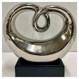 Chrome Abstract Loop Sculpture & Green Glass Dolphin