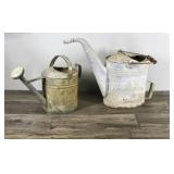 2 - Vintage Metal Watering Cans - One has a wooden handle
