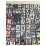 Lot of Trading Cards - Football - Basketball - Hockey & Baseball / All of them are in Top Loaders