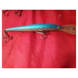 Vintage wooden jointed body Musky fishing lure and a plastic large minnow lure