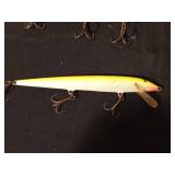 Vintage wooden Musky fishing lure and a Rapala 3 hook fishing lure