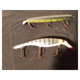 The Believer fishing lure and a wooden Musky fishing lure with metal tail
