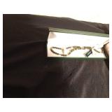 Flat of jewelry including Connemara Marble pin and necklace made in Ireland and Monet earrings